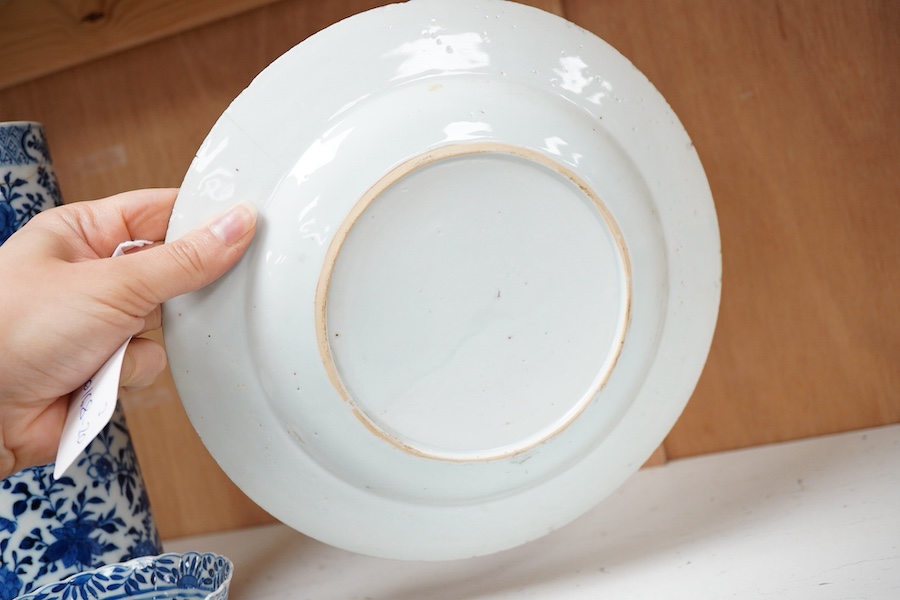 An early 20th century Chinese blue and white sleeve vase, 18th century plate and bowl, tallest 24.5cm